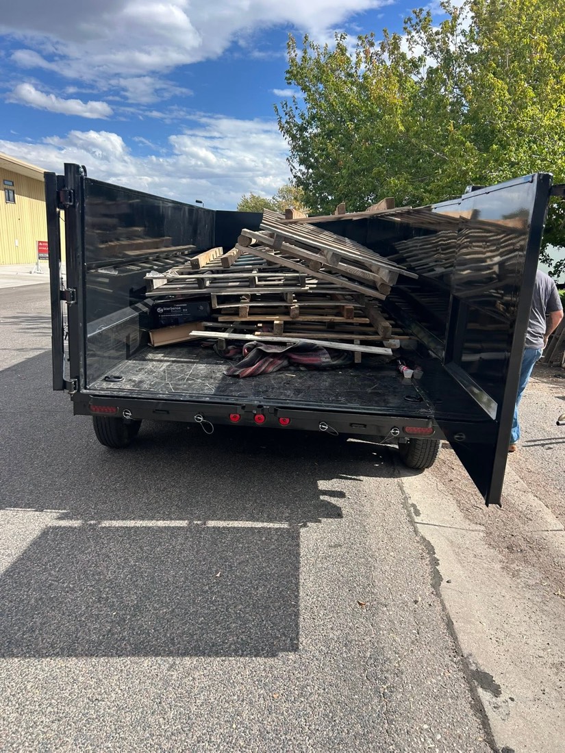 Wood pallets loaded in the WYCO dump trailer
