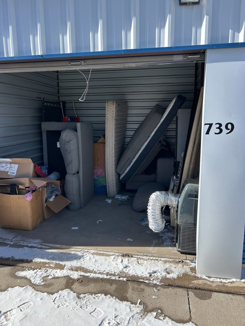Storage unit filled with items before removal