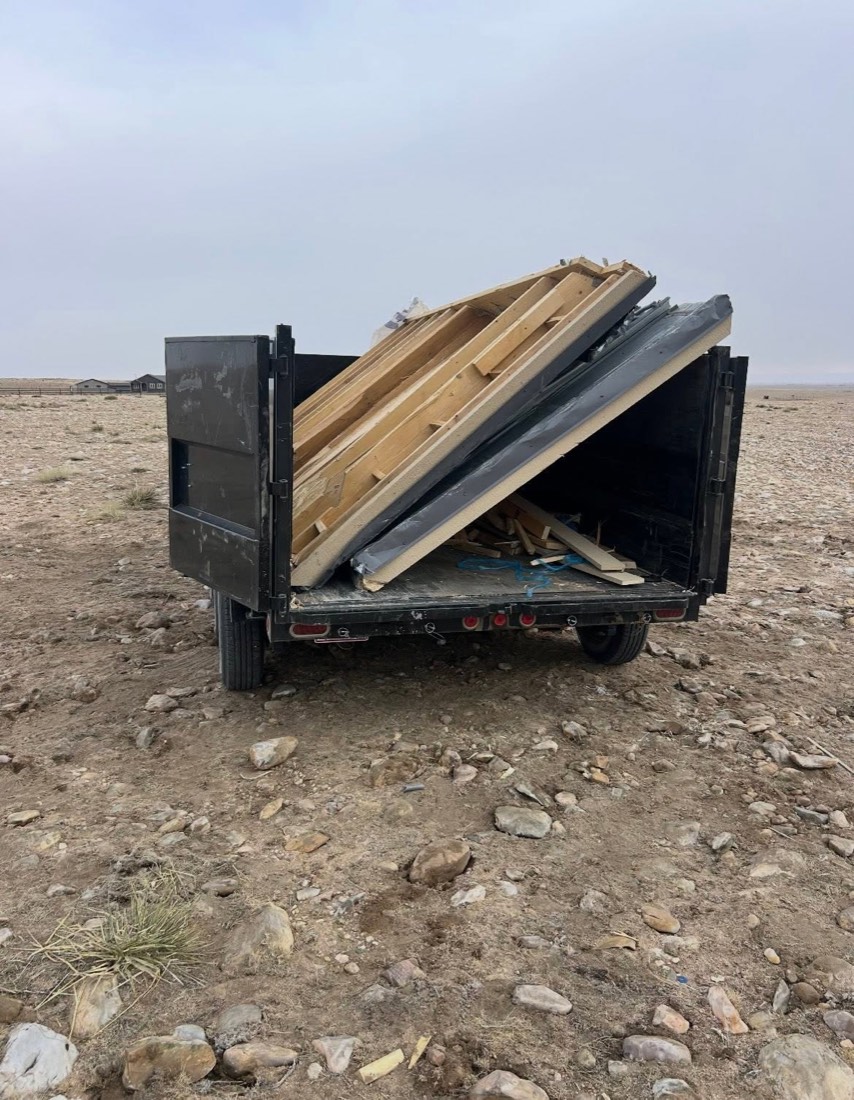Construction debris loaded into a dump trailer