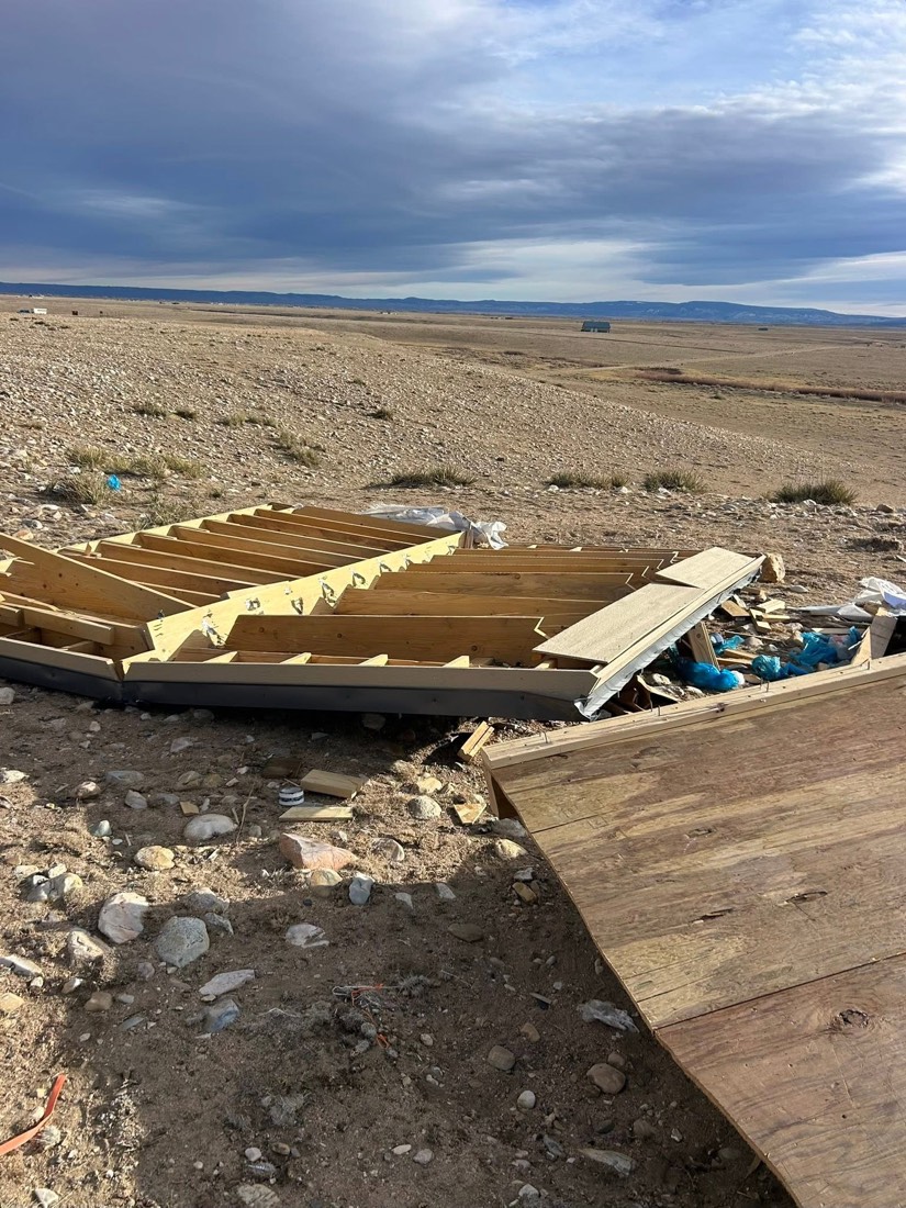 Wood and construction debris before removal