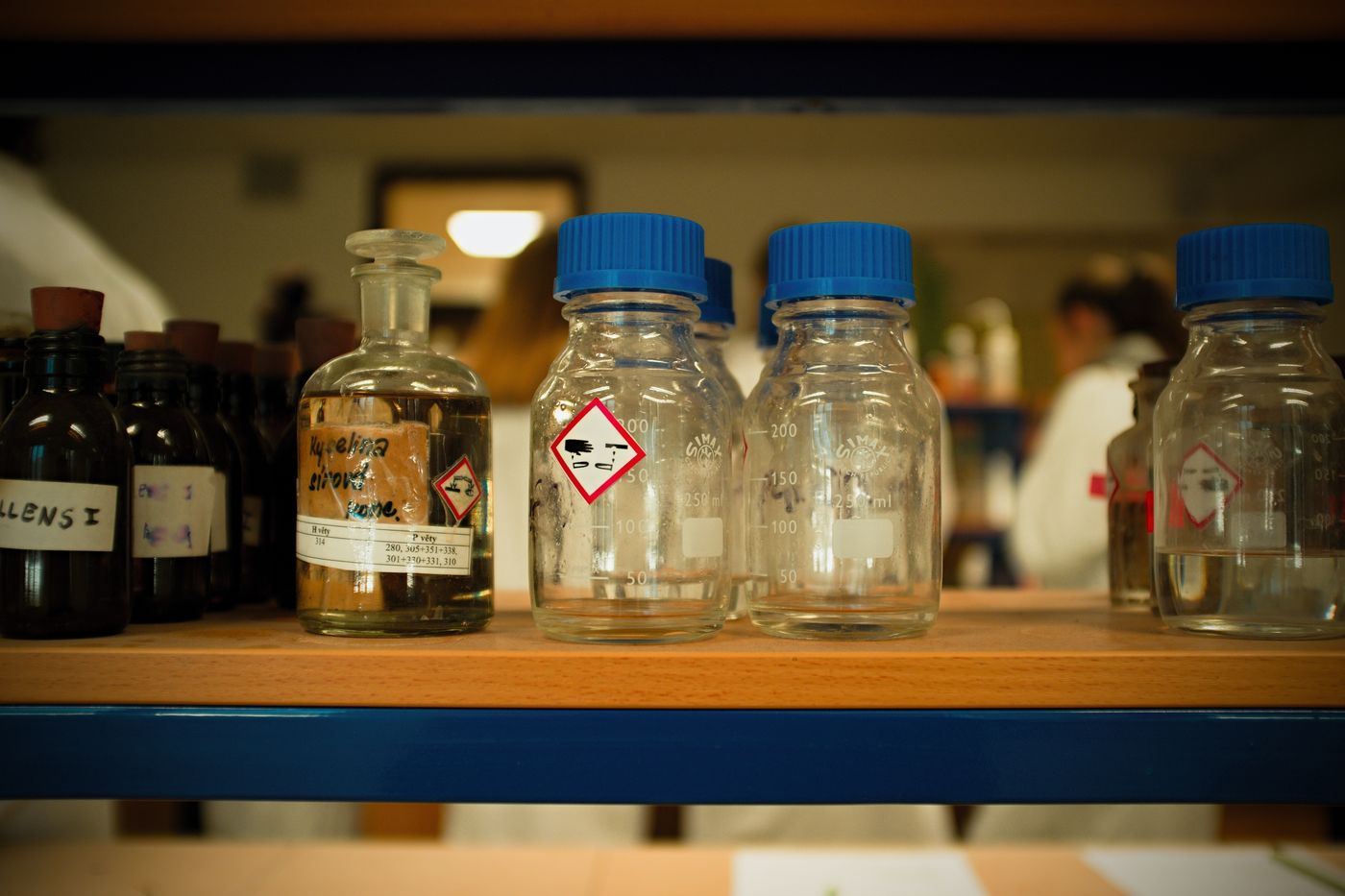 Chemical containers marked with hazardous-material labels